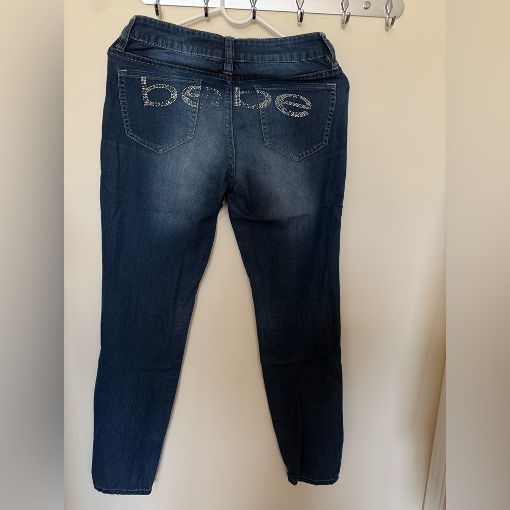 Bebe Blue Color Medium-Wash Rhinestone Logo Ankle Skinny Jeans. Size 27